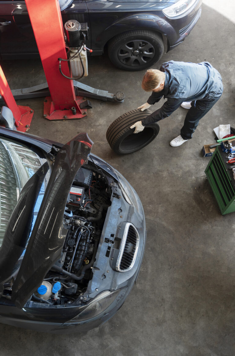 top view man repairing car